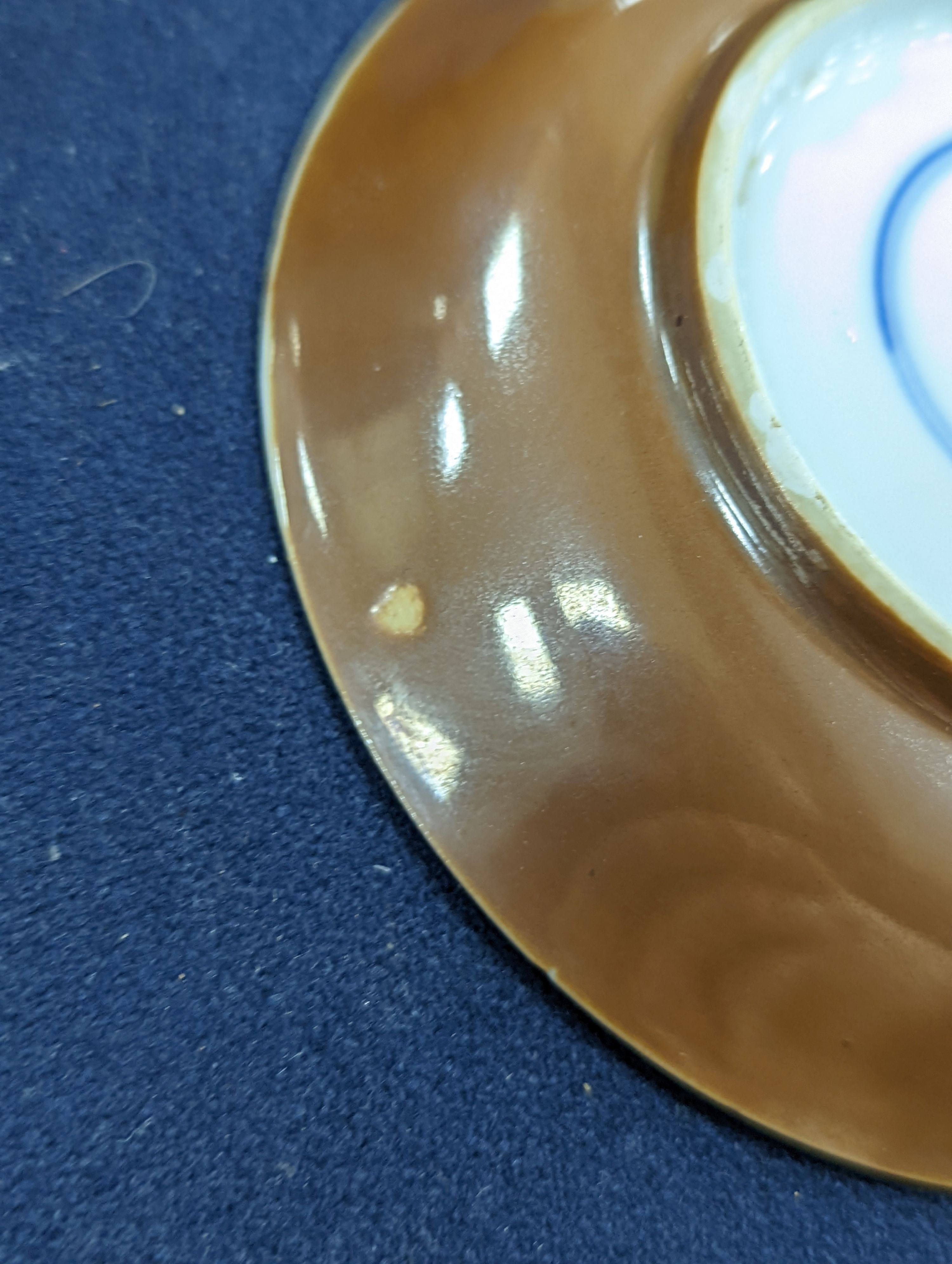 A Chinese cafe au lait glazed saucer, three bowls and a stem cup